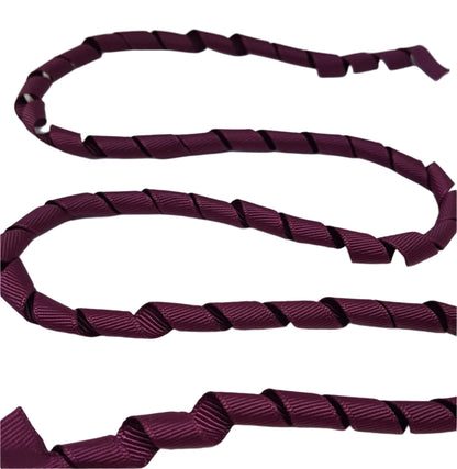 Burgundy ribbon on a white background