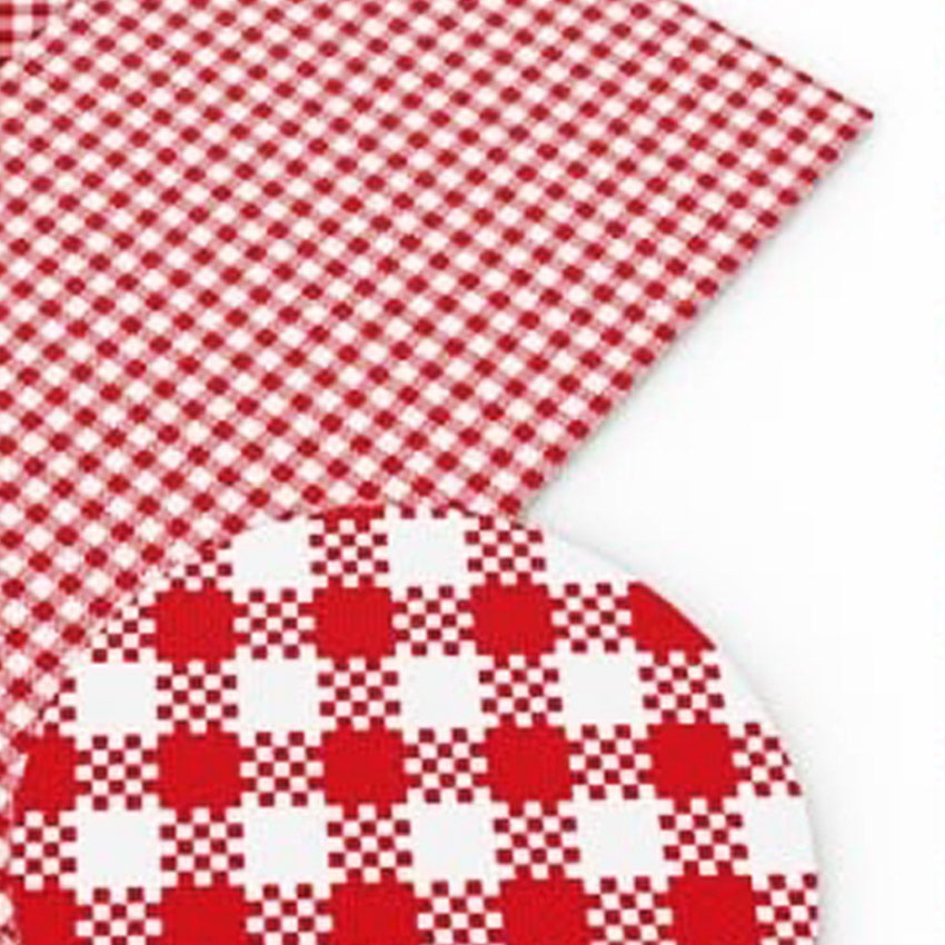 A sample of red gingham leatherette on a white background