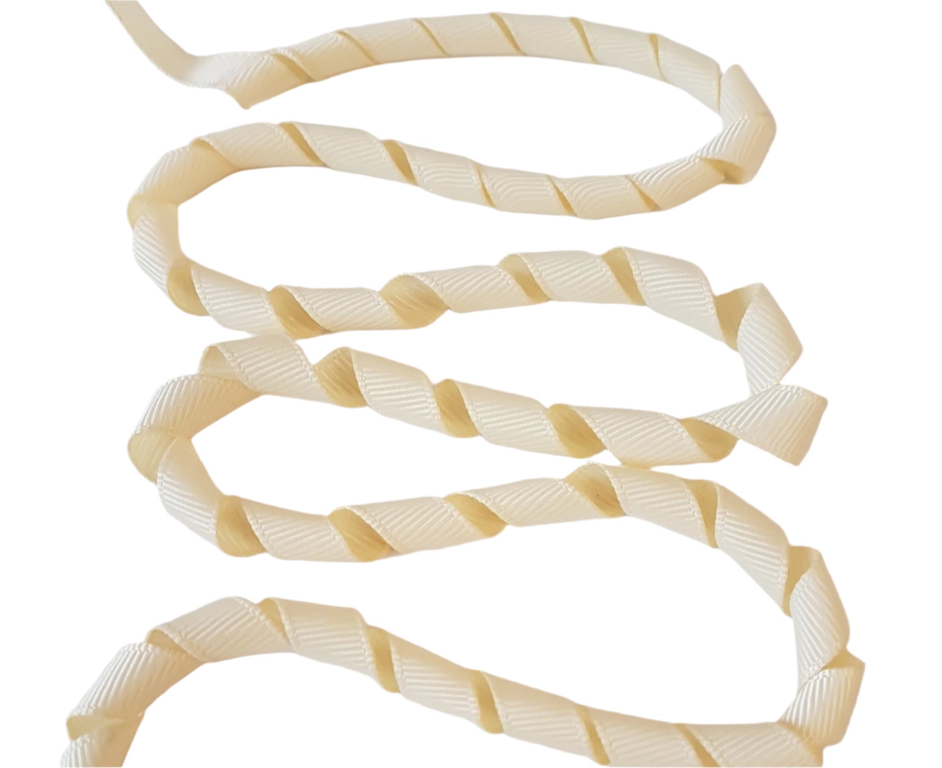 Coiled beige and white ribbon on a white background