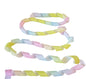 Pastel-colored ribbon with a twisted design on a white background