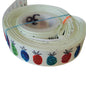 Roll of colorful ribbon with fruit patterns on a white background. Pineapples 