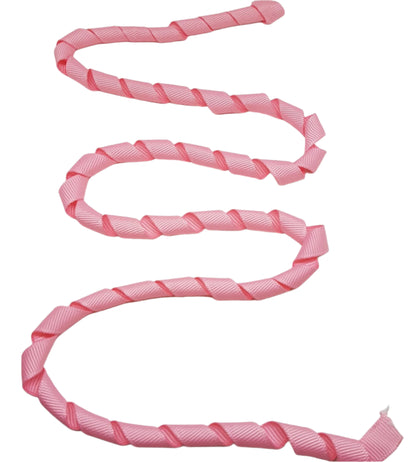 Pink twisted ribbon on a white background