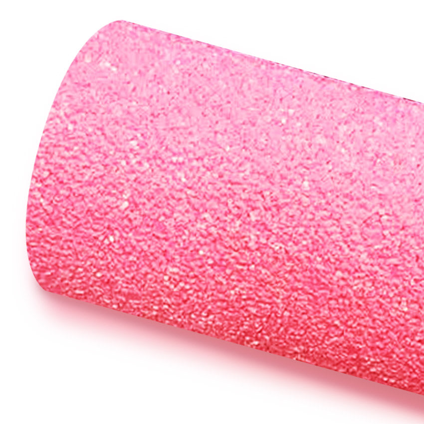 A roll of pink glitter fabric on a white background