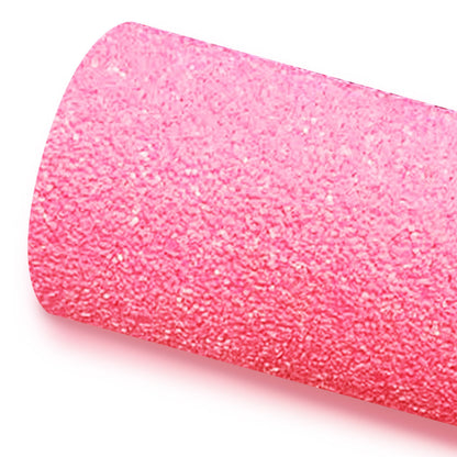 A roll of pink glitter fabric on a white background