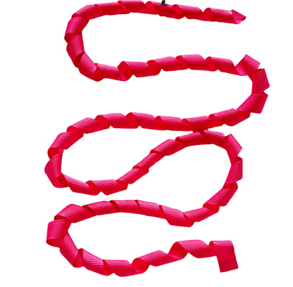 Red ribbon on a textured beige surface