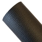 Close-up of black leather texture on a light background