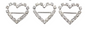 three heart-shaped brooches with diamond-like stones on a white background