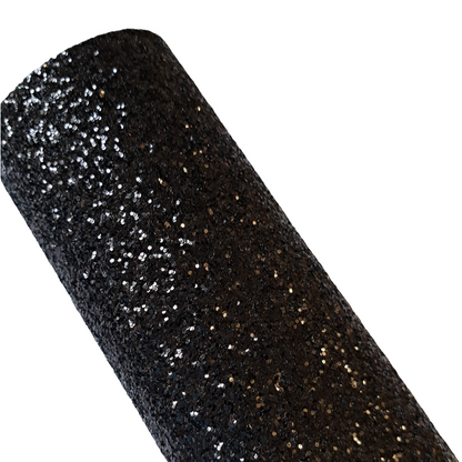 chunky glitter black coloured roll on a white background