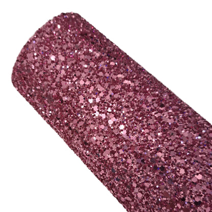 chunky glitter dusty rose coloured roll on a white background
