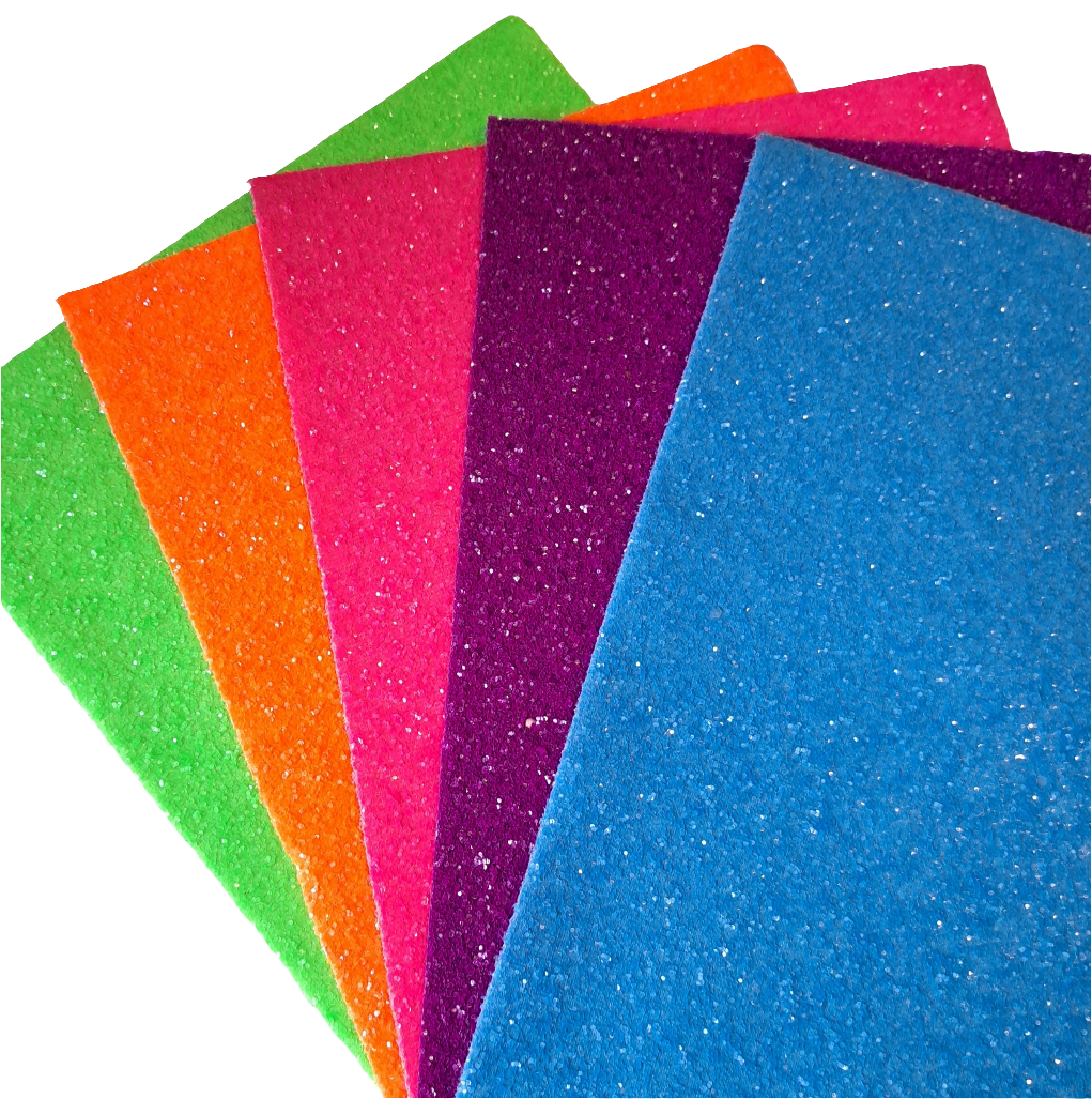 chunky glitter green orange pink purple and blue coloured sheets on a white background