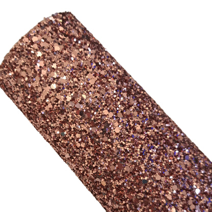 chunky glitter rose gold coloured roll on a white background