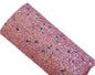 chunky glitter sequins pink coloured roll on a white background