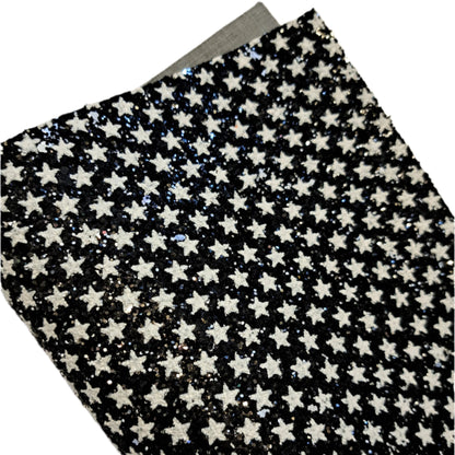 chunky glitter white stars on black coloured roll on a white background