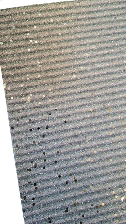 chunky glitter red, blue and yellow stripes coloured roll on a white background