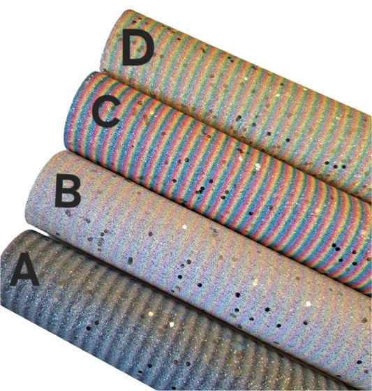 four rolls of chunky glitter fabric with labels on a white background