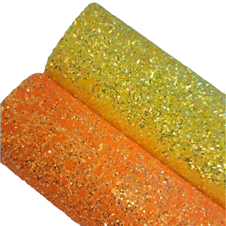 chunky glitter yellow and orange coloured rolls on a white background