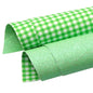 gingham checked and glitter double sided fabric in green and white colours on a white background