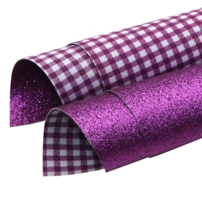 gingham checked and glitter double sided fabric in purple and white colours on a white background