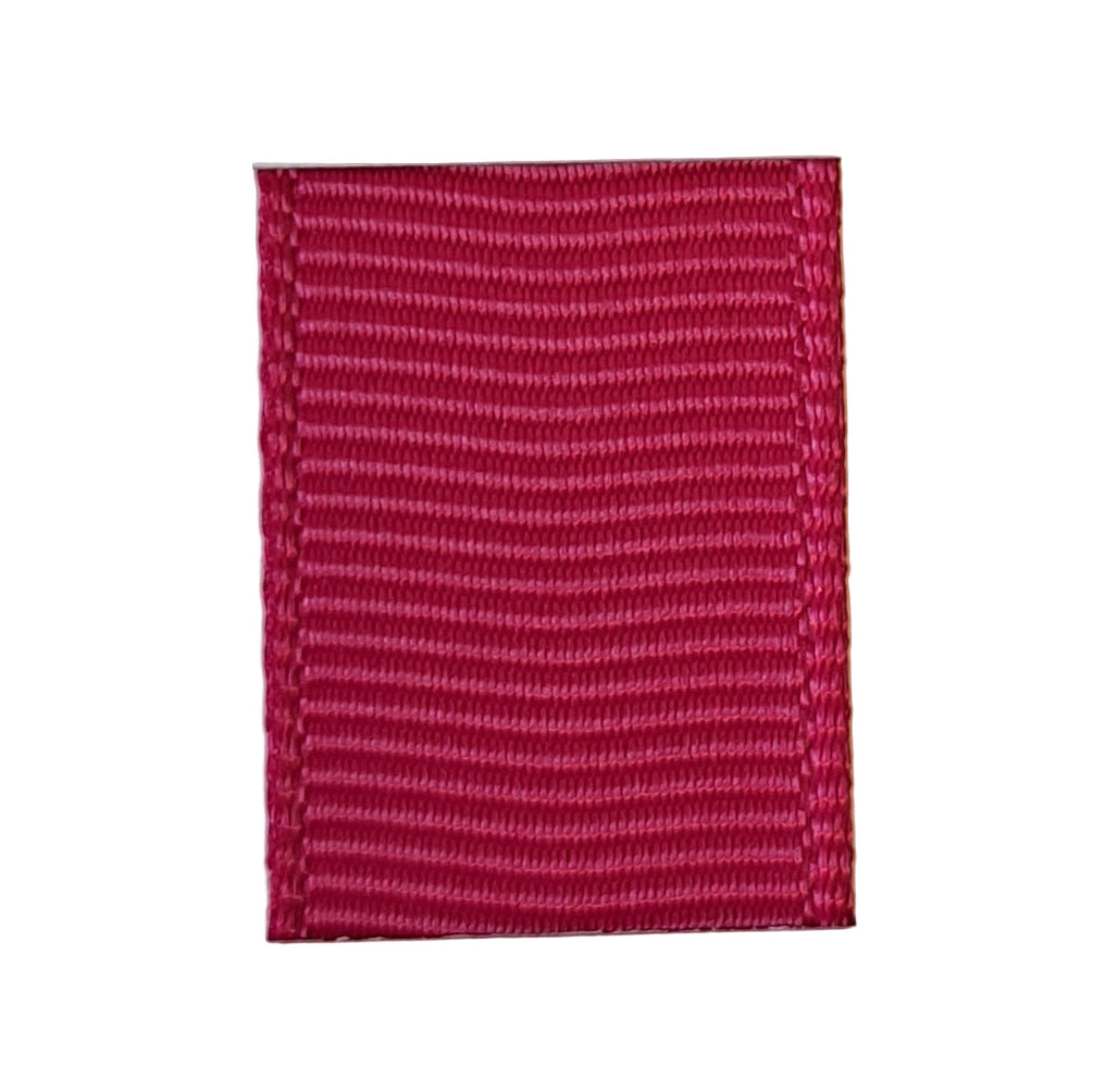 grosgrain ribbon in azalea colour on white background