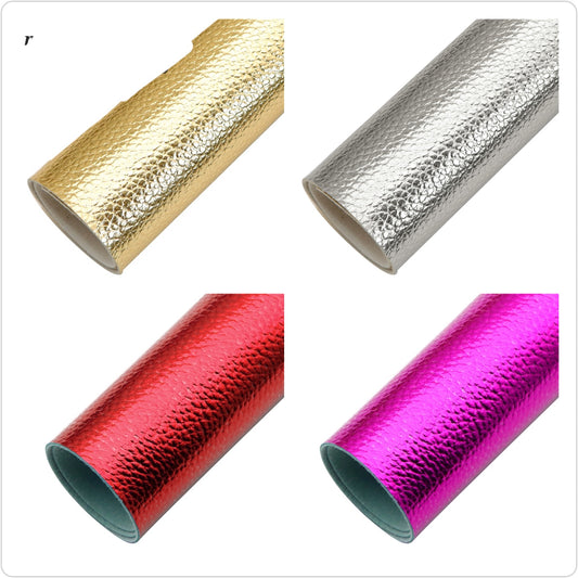 colourful metallic roll in gold, silver, red and purple colour on a white background