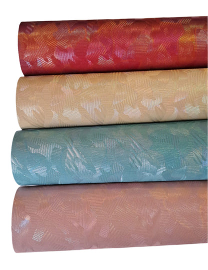 colourful metallic roll in red, cream, blue and pink colours on a white background