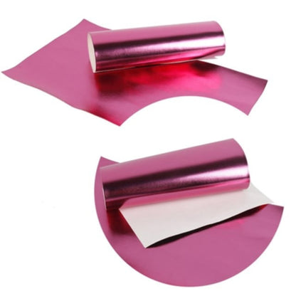 metallic ribbon in pink colour on a white background