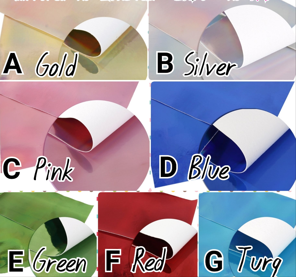 set of colourful mirrored metallic sheets on a white background