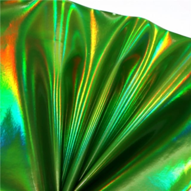 colourful mirrored metallic sheet in green colour on a white background