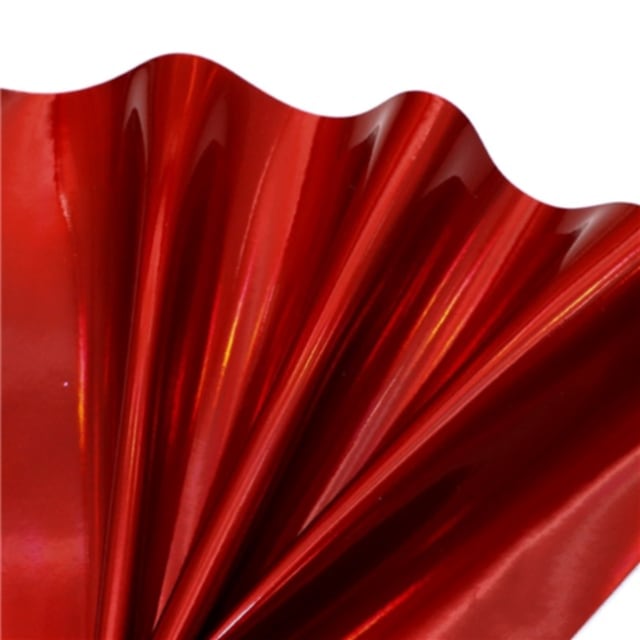 colourful mirrored metallic sheet in red colour on a white background