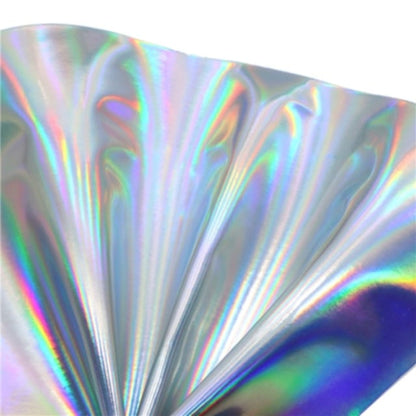 colourful mirrored metallic sheet in iridescent colours on a white background