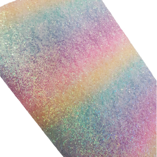 Multicolored glittery paper with a gradient effect on a white background