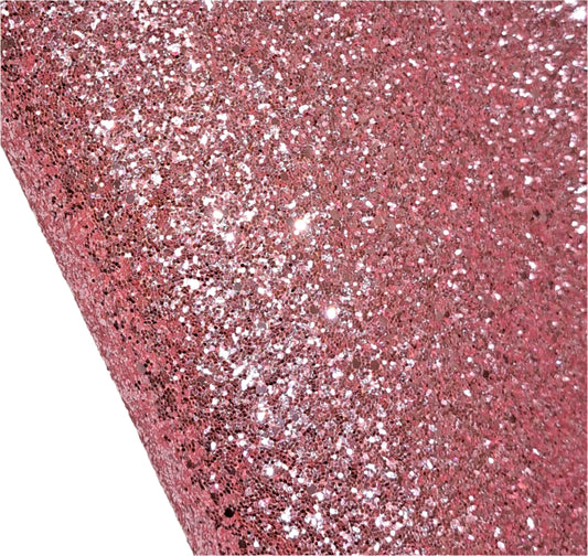 Close-up of pink glittery material on a white background