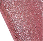 Close-up of pink glittery material on a white background