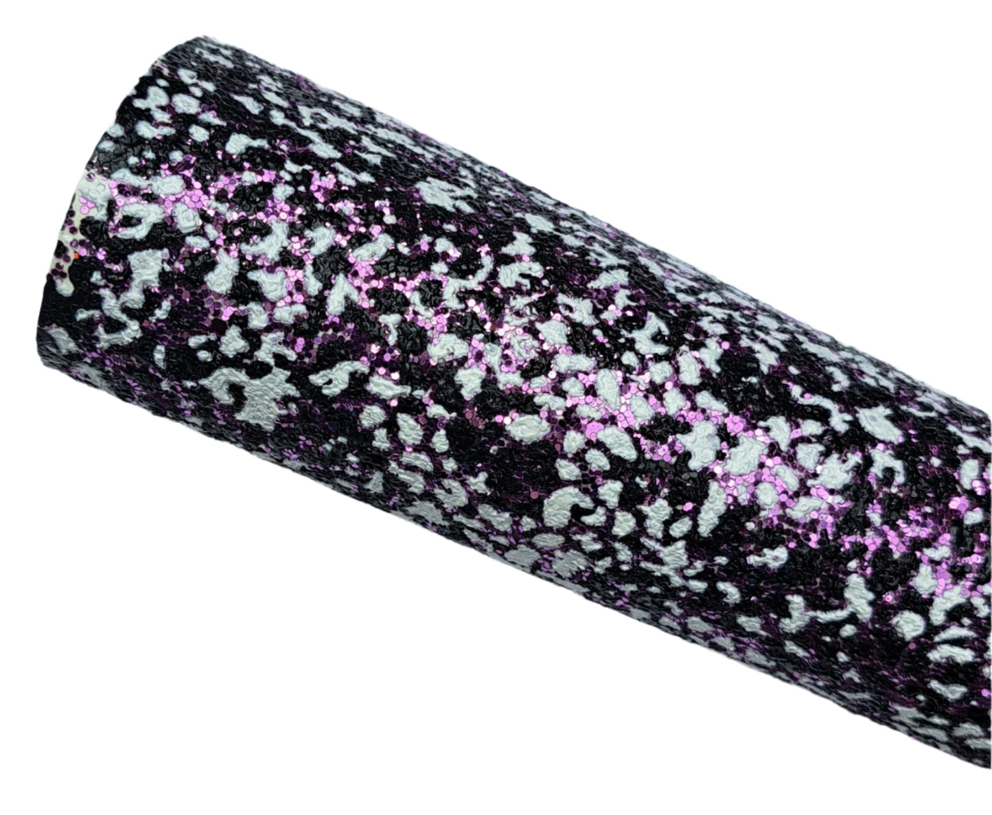 Black and white patterned fabric roll with pink specks on a white background