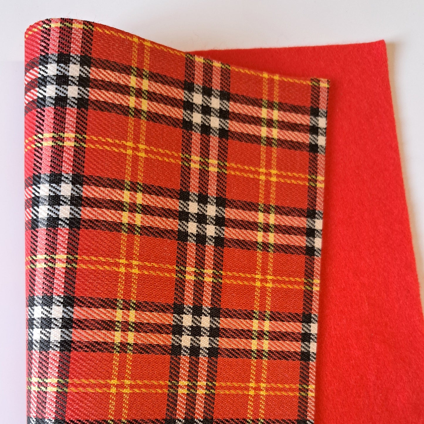 Plaid fabric with red background