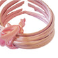 satin headbands in a baby pink colour on a white background