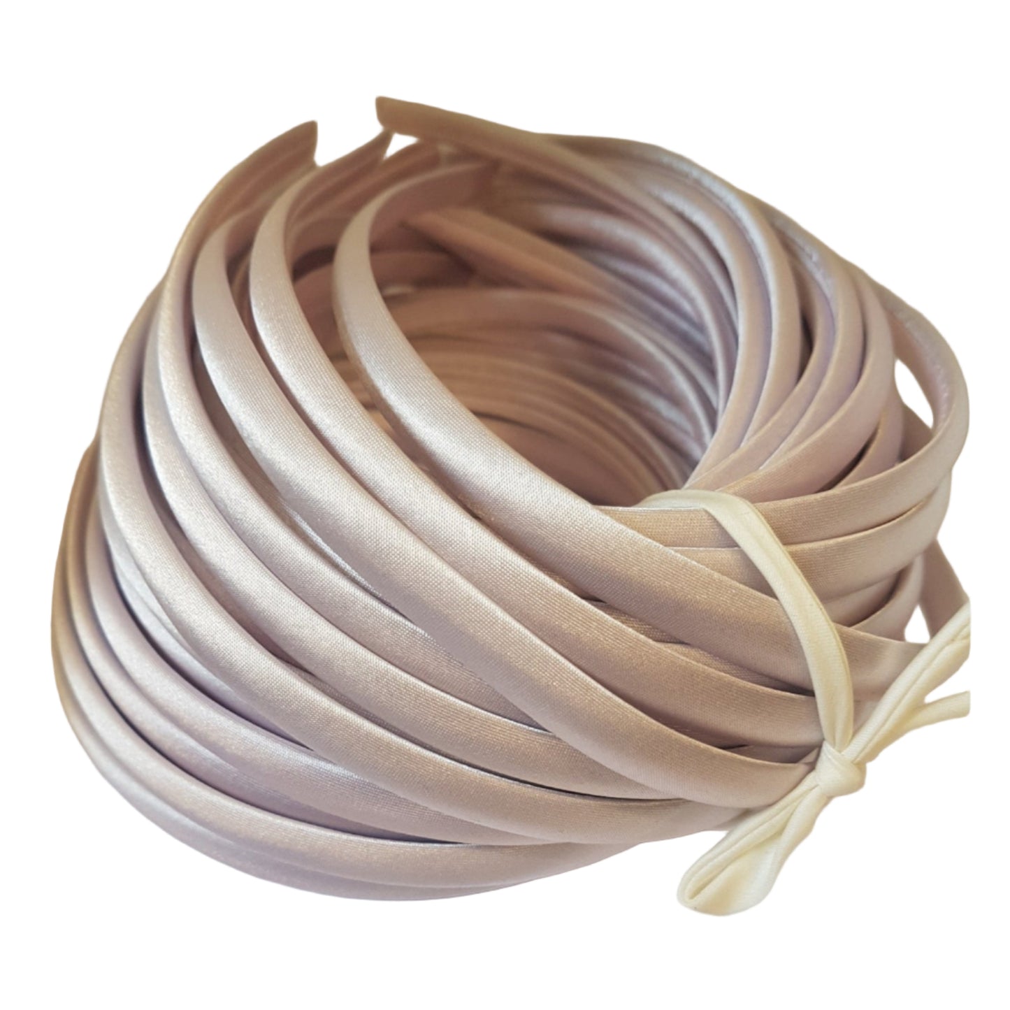 satin headbands in a hint of pink colour on a white background