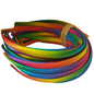 satin headbands in rainbow colours on a white background