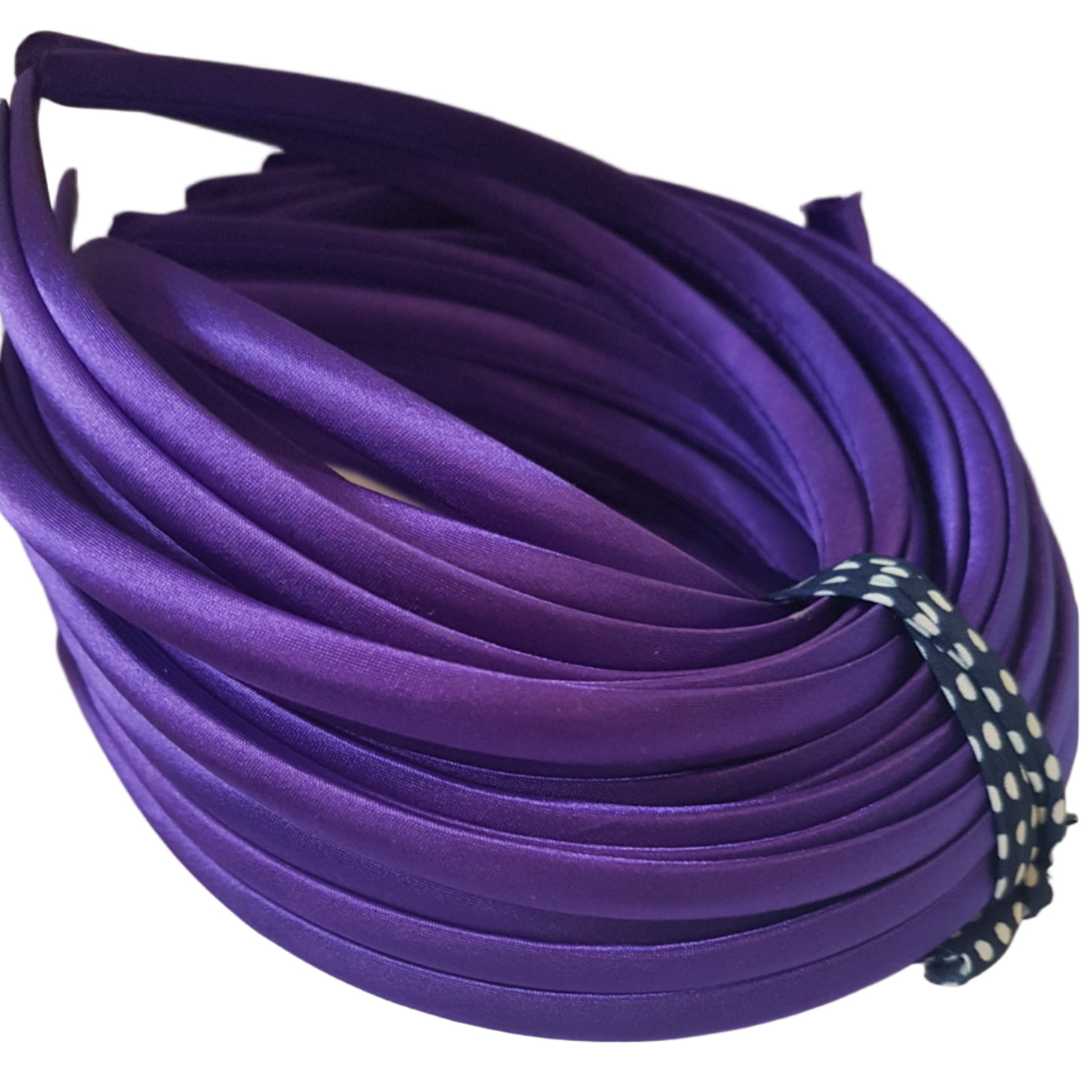 satin headbands in a regal purple colour on a white background