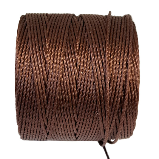 a roll of superlon bead cord in dark brown on a white background