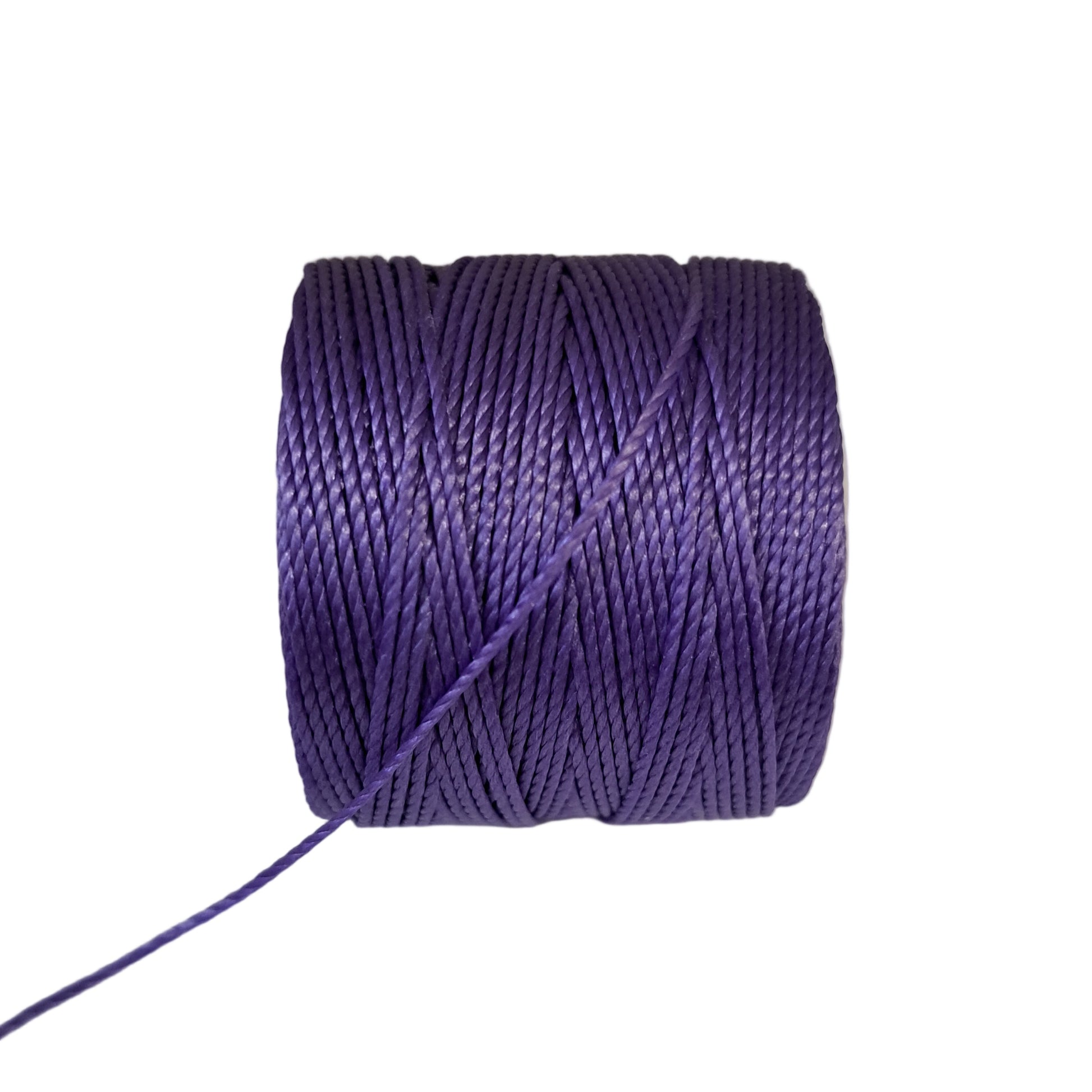 a roll of superlon bead cord in grape on a white background