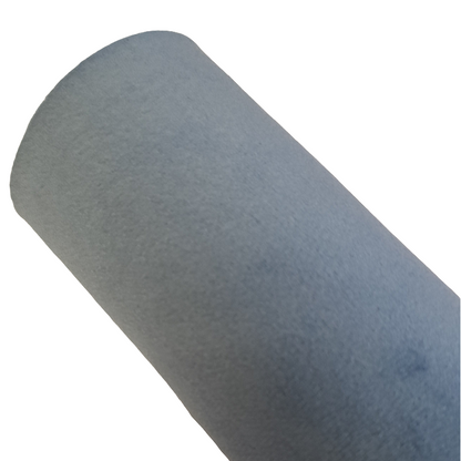 a roll of blue coloured velvet fabric roll on a white background