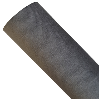 a roll of grey coloured velvet fabric roll on a white background